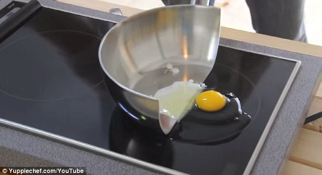 A video featuring half a saucepan shows the benefits of cooking using an induction hob, or stove. Eggs (pictured) and chocolate are placed in the half pan to show that they cook quickly when touching a magnetic cooking pot, but stay raw when placed directly on the induction hob